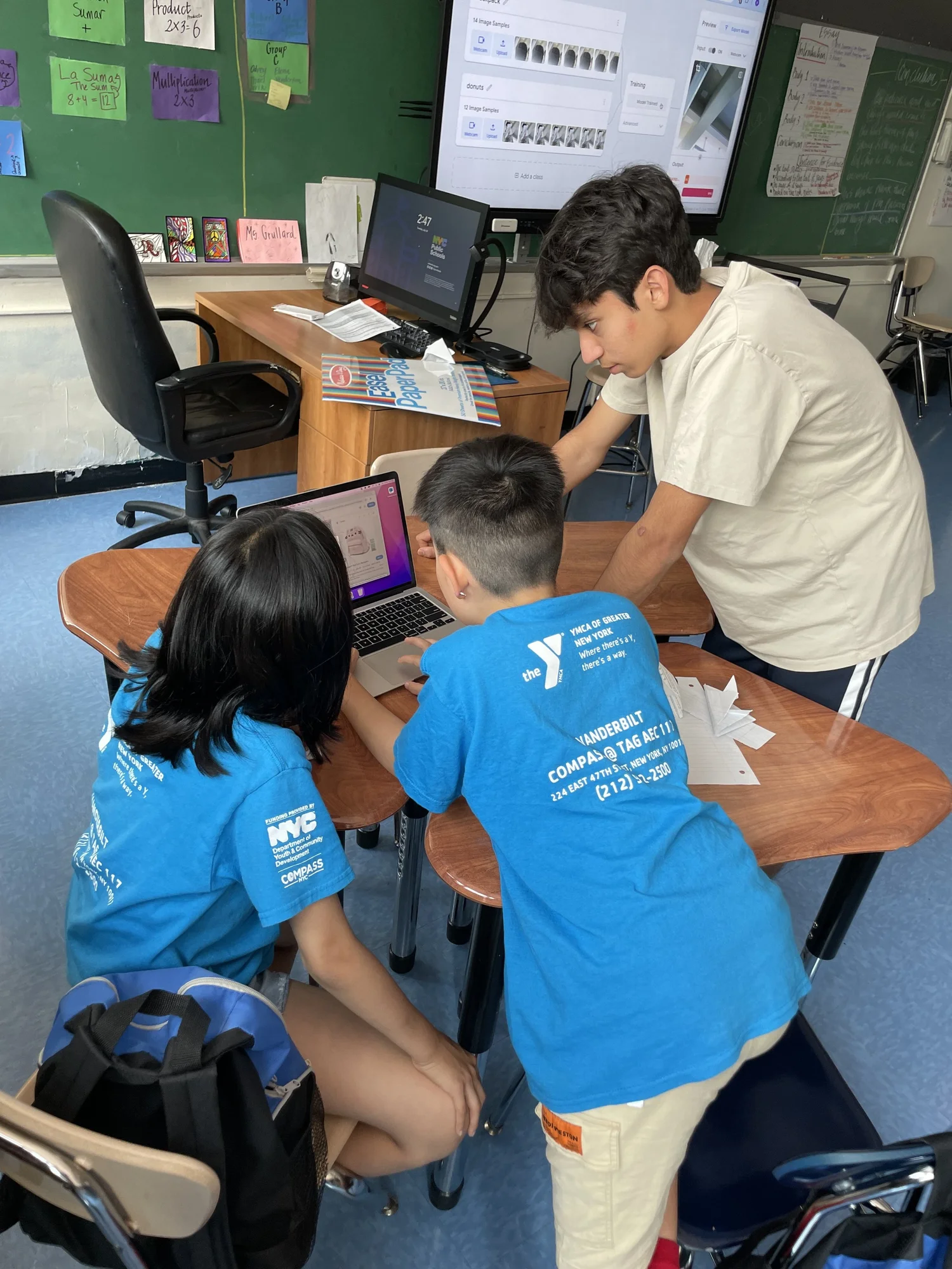 Students engaged in a hands-on EngageAI activity